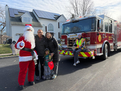 Councilman Umesh Agrawal and Family Celebrate the Holiday Season with Raritan Firefighters